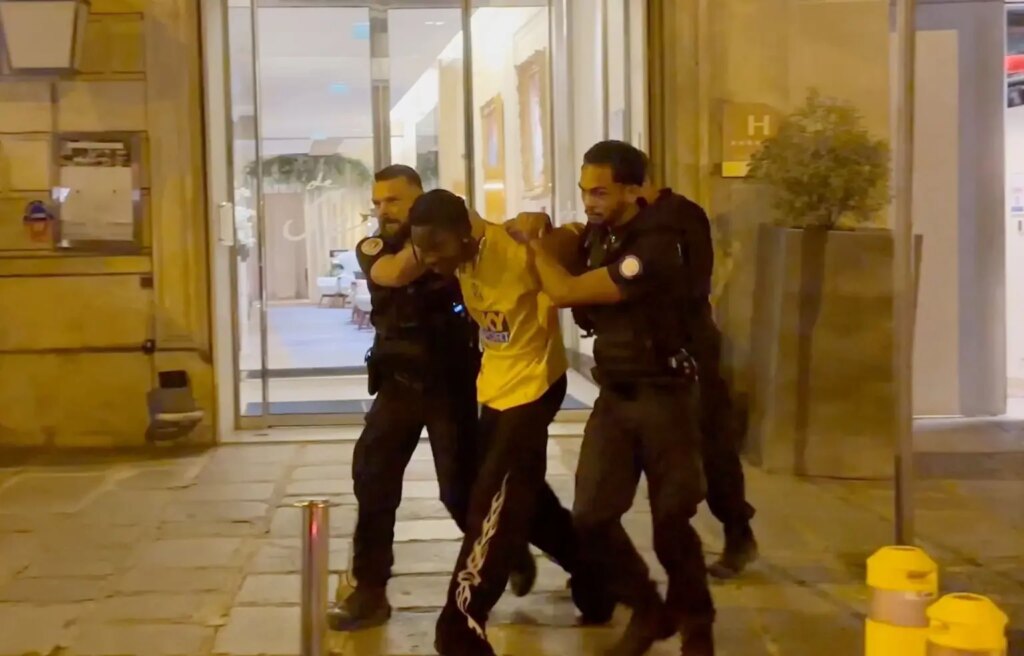 Video: Rapper Travis Scott is being dragged out of 5-star Paris hotel in handcuffs following arrest