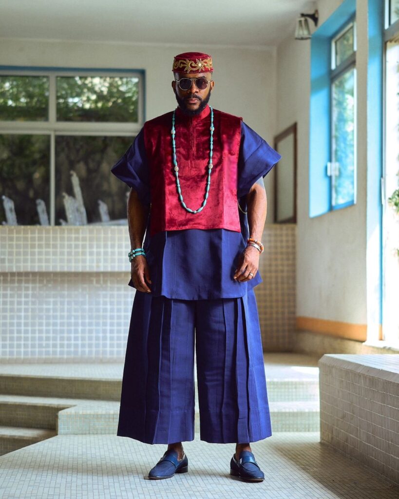 Ebuka Obi-Uchendu Slays BBNaija9 Eviction Night in Ugo Monye’s Wide-Legged Trousers & Bold Red Accent